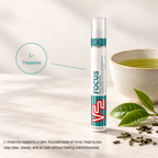 V22 Focus spray with an L-theanine callout beside a cup of green tea