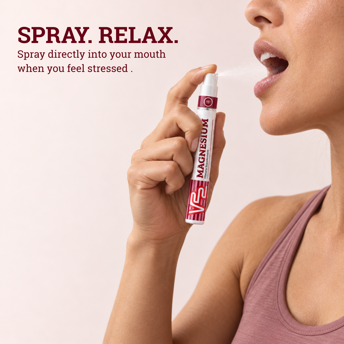 Woman spraying V22 Magnesium directly into her mouth: Spray. Relax.